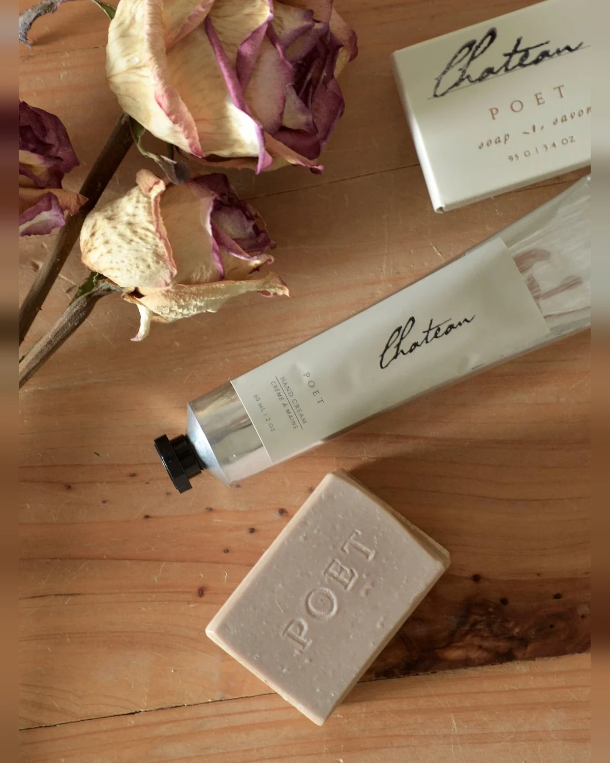 Poet Farm Chateau hand cream in its 60 mL aluminum tube with dried roses